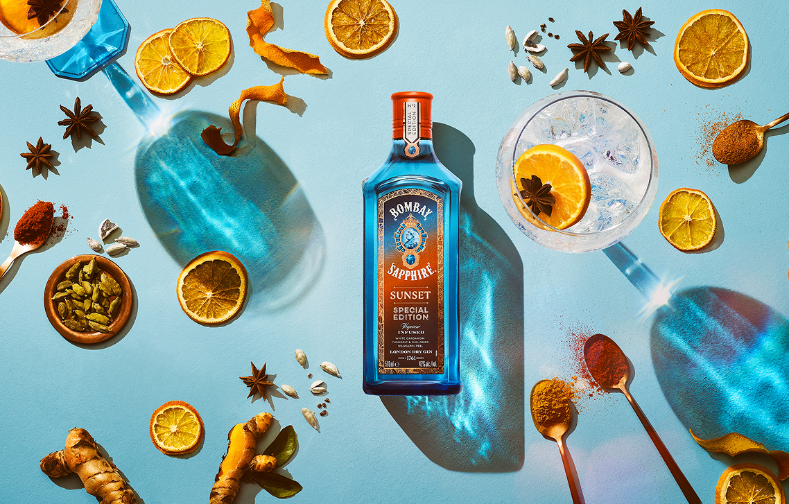 Bombay Sapphire Sunset special edition bottle surrounded by citrus and spices